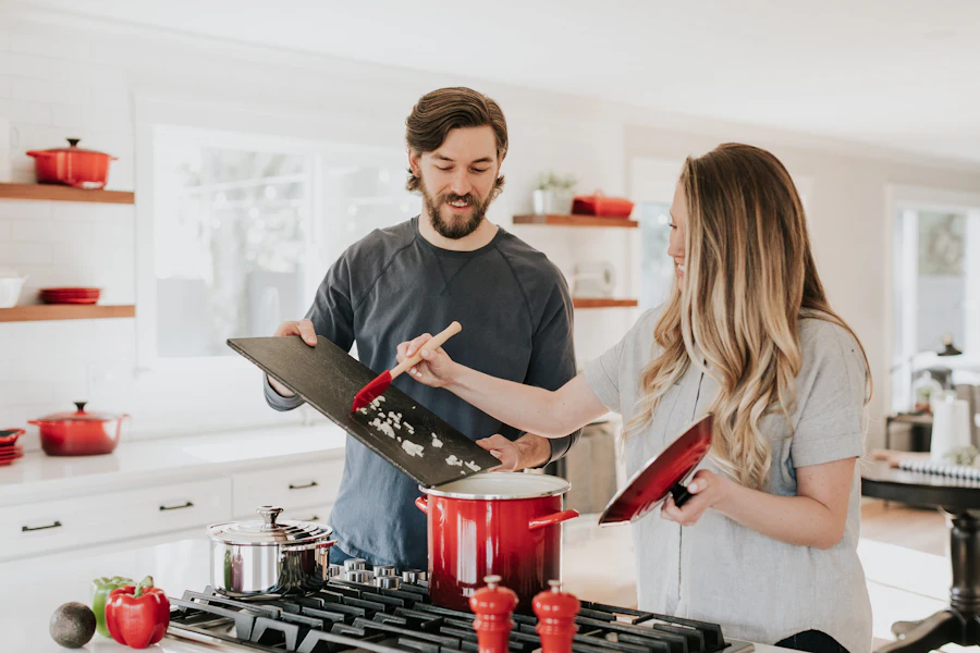 Couple cooking together in their rental home